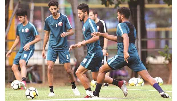 Qatar players take part in a training session on the eve of their AFC U-19 Championship Group A match against the UAE in Jakarta, Indonesia, yesterday. PICTURES: Fadi al-Assaad