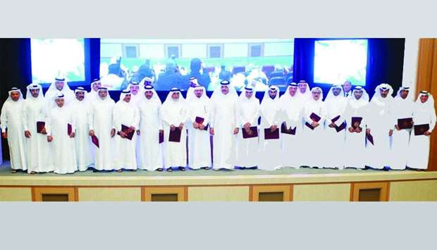 HE the Minister of Municipality and Environment Mohamed bin Abdullah al-Rumaihi with the recipients of certificates