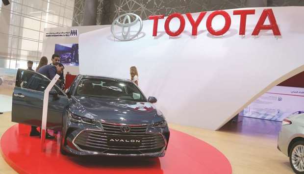 Visitors take a look at the all-new 2019 Toyota Avalon at the Toyota booth. PICTURE: Jayan Orma