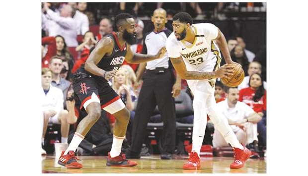 New Orleans Pelicansu2019 Anthony Davis (right) handles the ball while Houston Rocketsu2019 James Harden defends during the game on Wednesday. (USA TODAY Sports)