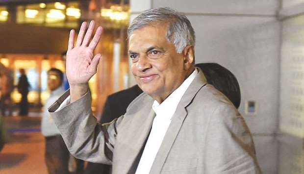 Sri Lankau2019s Prime Minister Ranil Wickremesinghe gestures as he arrives at the Indira Gandhi international airport in New Delhi yesterday. Sri Lankau2019s Prime Minister Ranil Wickremesinghe is on a three-day visit to India.