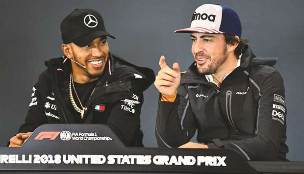 Mercedes driver Lewis Hamilton (left) of Great Britain and McLaren driver Fernando Alonso of Spain during the drivers press conference in Austin, United States, yesterday. (Getty Images/AFP)