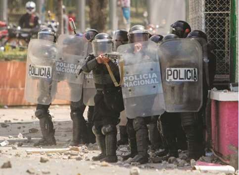 An April 19, 2018, file photo of policemen firing rubber bullets at a protest against the governmentu2019s reforms in the Institute of Social Security in Managua.