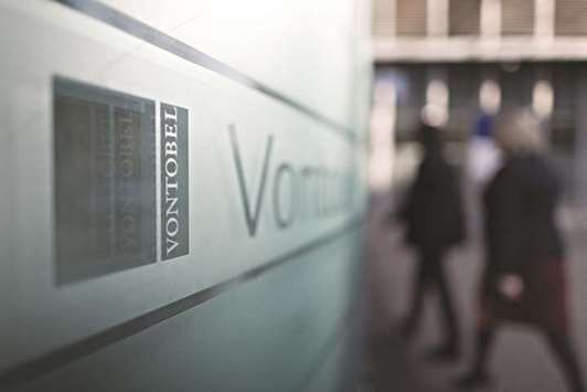 A logo is seen on a sign outside the Vontobel Holding headquarters in Zurich. The Swiss bank founded 94 years ago has registered an entity with the US Securities and Exchange Commission that focuses on wealthy clients liable for US taxes, Bloomberg reported. Yesterday, it took over $1.2bn in US client assets from a Swiss rival.