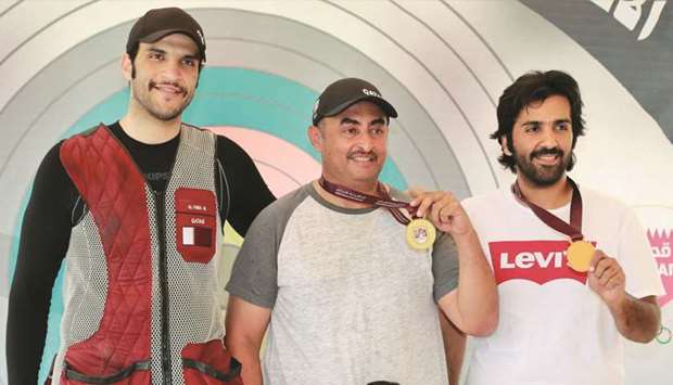 Winners of the Qatar Shooting and Archery Association (QSAA) Cup pose with their medals at the Lusail Complex.