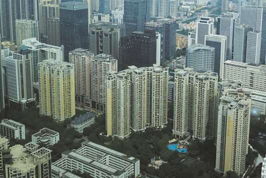 Residential and commercial buildings are seen in Guangzhou, China. Growth in real estate investment in China, which mainly focuses on residential but also includes commercial and office space, rose 8.9% in September from a year earlier, the National Bureau of Statistics data showed yesterday.