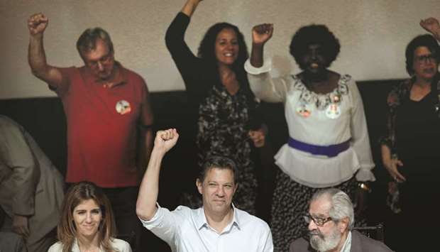Fernando Haddad, presidential candidate of Brazilu2019s leftist Workersu2019 Party (PT), waves as he arrives at the engineers club to attend a debate in Rio de Janeiro, Brazil, yesterday.