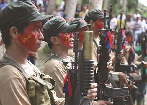 File photo shows members of the New Peopleu2019s Army (NPA) at the Sierra Madre mountain range.