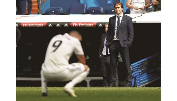 Real Madrid coach Julen Lopetegui looks dejected after the loss in their La Liga match against Levante at Santiago Bernabeu Stadium in Madrid, Spain, yesterday. (Reuters)