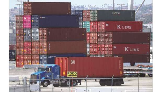 Trucks offload containers from a ship at the port of Los Angeles. In the US, Markitu2019s final reading for September for its manufacturing purchasing manageru2019s index edged up to 55.6 from 54.7 in August, but the Institute of Supply Managementu2019s index slipped to 59.8 in September from 61.3 in August.