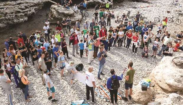 Protesters stand on the dried-out riverbed of Cijevna River in Dinosa village, near Tuzi, Montenegro.