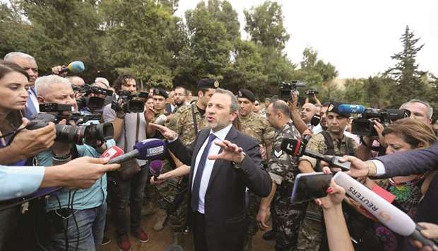Lebanese Foreign Minister Gebran Bassil gestures as he speaks during a tour for diplomats and journalists near the airport in Beirut yesterday.