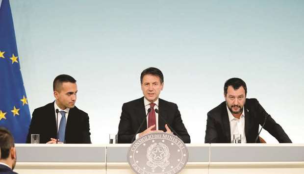 Labour and Industry Minister Di Maio, Prime Minister Conte, and Interior Minister Salvini at the news conference after a cabinet meeting at Chigi Palace in Rome.