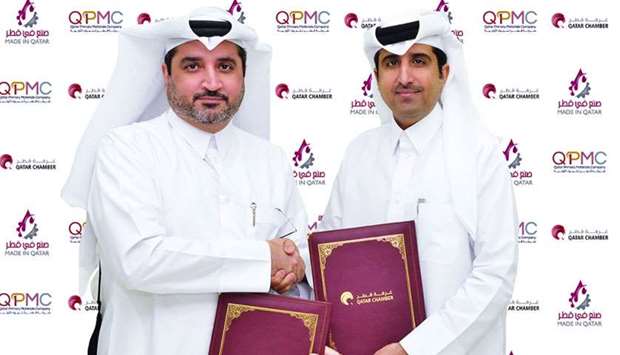 Qatar Chamber director-general Saleh bin Hamad al-Sharqi and QPMC CEO Essa Mohamed Ali Kaldari shaking hands after signing the 'Made in Qatar' sponsorship agreement at the Chamberu2019s headquarters in Doha