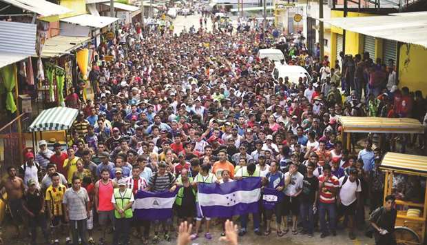 Honduran migrants heading in a caravan to the US, hold a demonstration demanding authorities to allow the rest of the group to cross, in Ciudad Hidalgo, Chiapas state, Mexico.