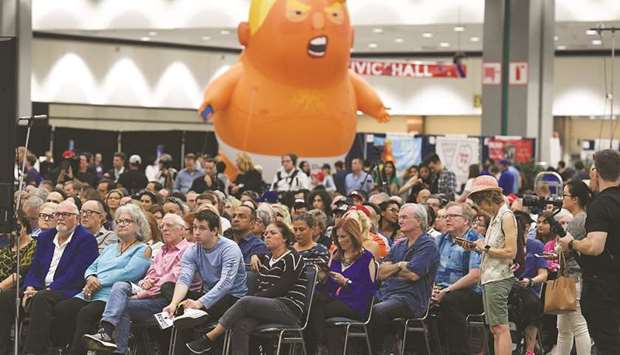 The u2018Baby Trumpu2019 balloon watches over the crowd during a panel discussion at the 2018 Politicon in Los Angeles over the weekend. The two day event covered all things political with dozens of high profile political figures.