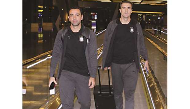 Al Saddu2019s Gabi (right) and Xavi Hernandez at the Hamad International Airport in Doha yesterday, ahead of their departure to Tehran for the AFC Champions League semi-final against Persepolis.