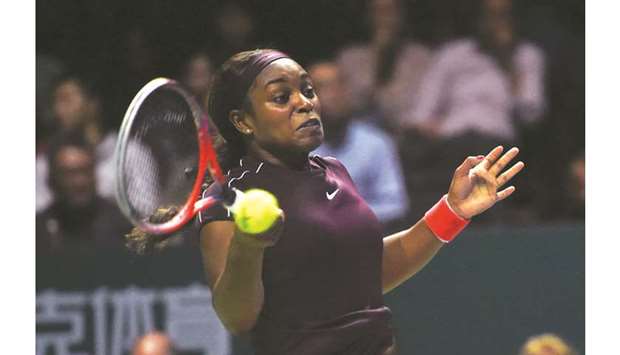 Sloane Stephens of the US hits a return against Japanu2019s Naomi Osaka (not pictured) during their WTA Finals singles match in Singapore yesterday. (AFP)