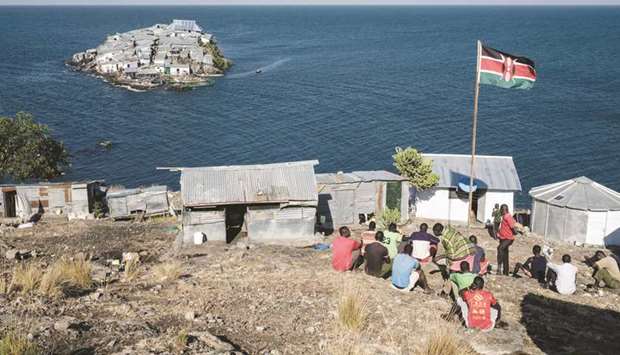 A Kenyan flag flies on a base of Kenyan marine police on Usingo island overlooking Migingo island.