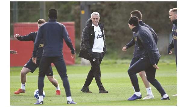 Manchester Unitedu2019s manager Jose Mourinho (centre) watches as his team trains at the Carrington Training complex in Manchester yesterday.  (AFP)