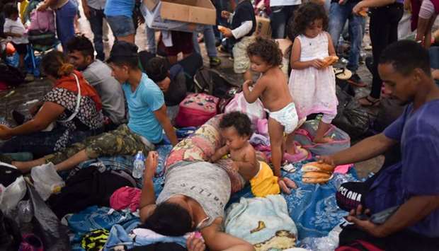 Honduran migrants taking part in a caravan heading to the US, rest at the main square in Tapachula, Chiapas state, Mexico.