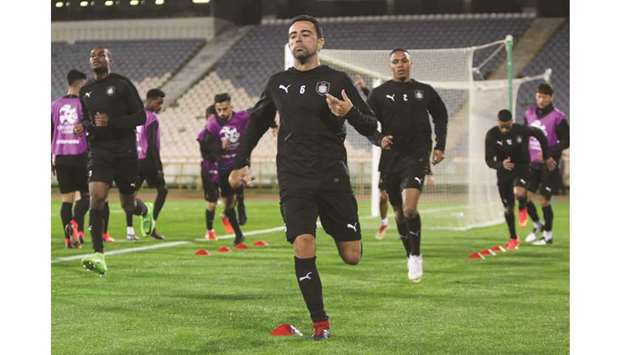 Al Sadd captain Xavi leads the team during a training session in Tehran yesterday.