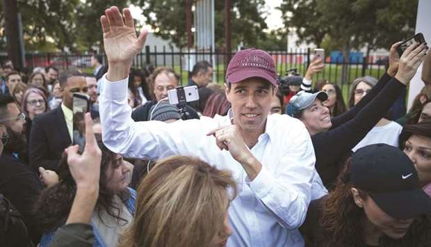 Democratic Senate candidate Beto Ou2019Rourke greets supporters near a polling place on the first day of early voting in Houston yesterday.