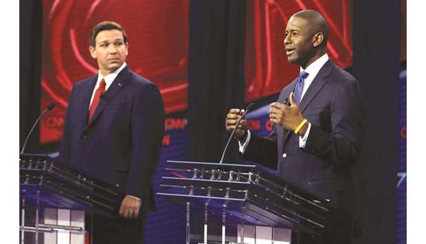 Florida Republican gubernatorial candidate Ron DeSantis (left) looks on during a CNN debate with Democratic gubernatorial candidate Andrew Gillum in Tampa on Sunday night.