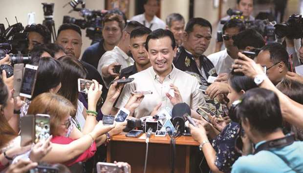 Senator Antonio Trillanes smiles as he speaks to members of the media at the senate building in Manila yesterday, after a local court denied a motion by Department of Justice for a warrant of arrest.