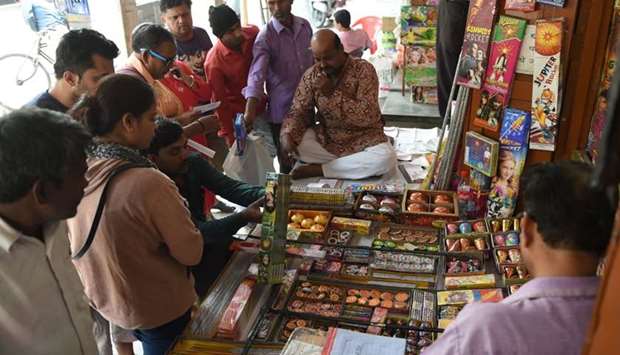 Indian customers visit a firecracker shop in New Delhi