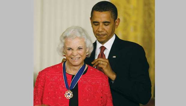 An August 12, 2009 file photo of President Barack Obama presenting the Medal of Freedom to Supreme Court Justice Sandra Day Ou2019Connor during a ceremony in the East Room of the White House in Washington.