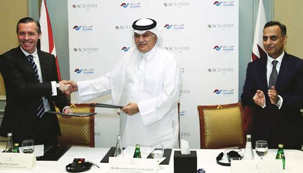 Cagney and al-Jaber shake hands as British ambassador Ajay Sharma looks on. PICTURE: Jayaram