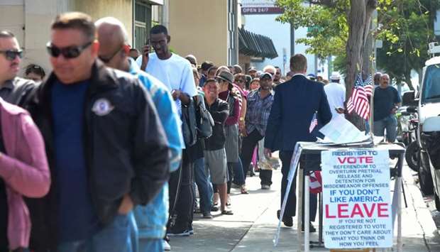 People wait in a long line to purchase lottery tickets outside the Blue Bird Liquor store in Hawthorne, California yesterday. AFP