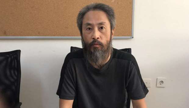 Japanese journalist Jumpei Yasuda is pictured at the local police headquarters in Hatay, Turkey.