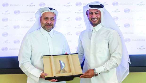 al-Jaida and al-Suwaidi after signing the pact to establish Qatar Sports Business District. 