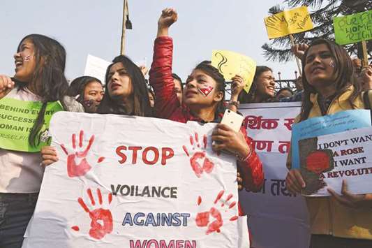 In this file photo, women shout slogans during an International Womenu2019s Day rally in Kathmandu.