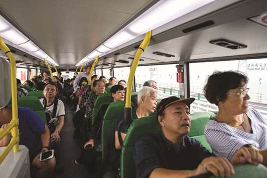 Passengers ride a bus being driven towards Macau on a section of the Hong Kong-Macau-Zhuhai Bridge yesterday.