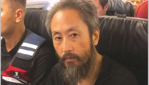 Japanese journalist Jumpei Yasuda is seen on a Istanbul-bound flight due for departure at Hatay airport, Turkey yesterday.