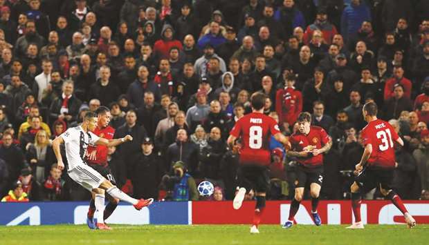 Juventusu2019 Cristiano Ronaldo shoots at the Manchester United goal during their Champions League match on Tuesday.