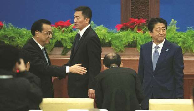 Chinese Premier Li Keqiang and Japanese Prime Minister Shinzo Abe during the event marking the 40th anniversary of the China-Japan Peace and Friendship Treaty at the Great Hall of the People in Beijing. u201cJapan and China are playing an indispensable role in the economic development of not just Asia but the world,u201d Abe said.