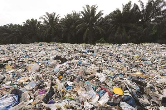 Plastic waste is piled outside an illegal recycling factory in Jenjarom, Kuala Langat, Malaysia.