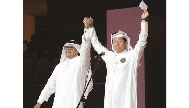 Qatar Gymnastics Federation president Ali al-Hitmi (left) and International Gymnastics Federation president Morinari Watanabe.