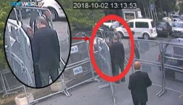 A still image taken from CCTV video and obtained by TRT World claims to show Saudi journalist Jamal Khashoggi, highlighted in a red circle by the source, as he stands with his fiancee Hatice Cengiz outside the Saudi Arabia's Consulate in Istanbul, Turkey October 2, 2018. Courtesy TRT World/Handout via Reuters