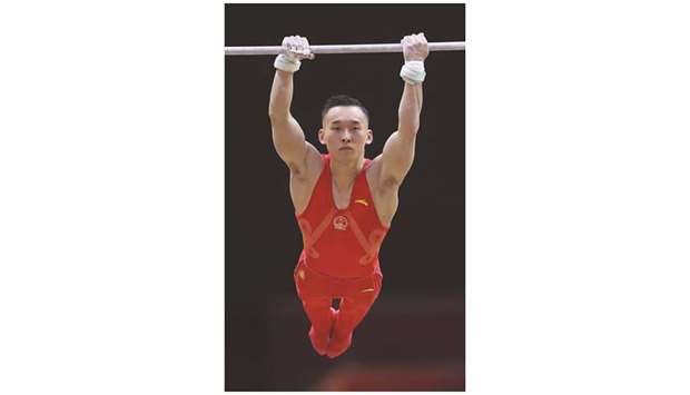 Chinau2019s Xiao Routeng  compete in the qualification round for menu2019s horizontal bar at the 2018 Artistic Gymnastics World Championships at Aspire Dome yesterday. (AFP)