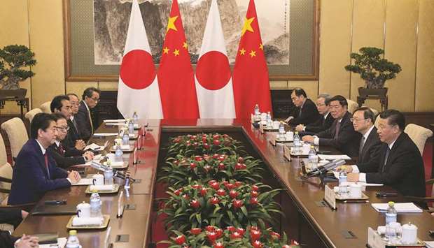 Japanu2019s Prime Minister Shinzo Abe speaks with Chinau2019s President Xi Jinping during a meeting at the Diaoyutai State Guesthouse in Beijing. u201cI believe active trade will deepen ties between Japanese and Chinese peoples further,u201d Abe said yesterday.