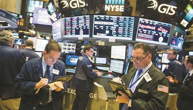 Traders work on the floor of the New York Stock Exchange (file). The unexplained absence of inflation during the last decadeu2019s US equity price boom is now being replaced in investor psychology by fears that inflation is finally pushing up costs and squeezing margins and may be one of the culprits in this monthu2019s selloff of US stocks.