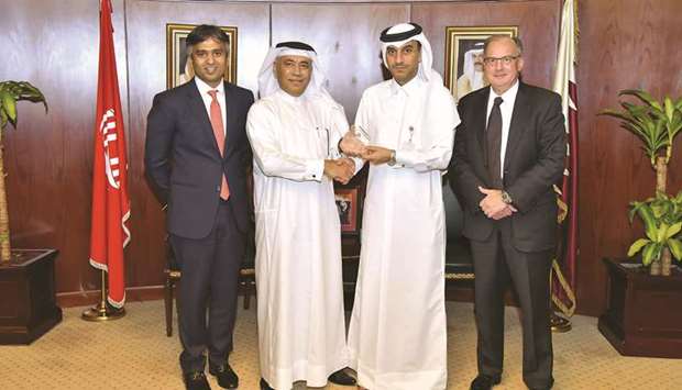 Al-Jamal (second right) with QIIB and Citibank officials at the award ceremony.