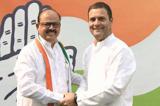 Congress President Rahul Gandhi welcomes back former Nationalist Congress Party leader Tariq Anwar into the party in New Delhi yesterday.