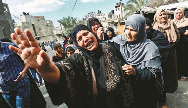 Relatives of 19-year-old Palestinian Nassar Abu Taim, who was killed the day before amid clashes following a protest at the Israel-Gaza border fence, react during his funeral in Khan Yunis in the southern Gaza Strip, yesterday.
