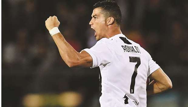 Juventusu2019 Portuguese forward Cristiano Ronaldo celebrates after scoring against Empoli at the Carlo Castellani Stadium in Empoli yesterday.